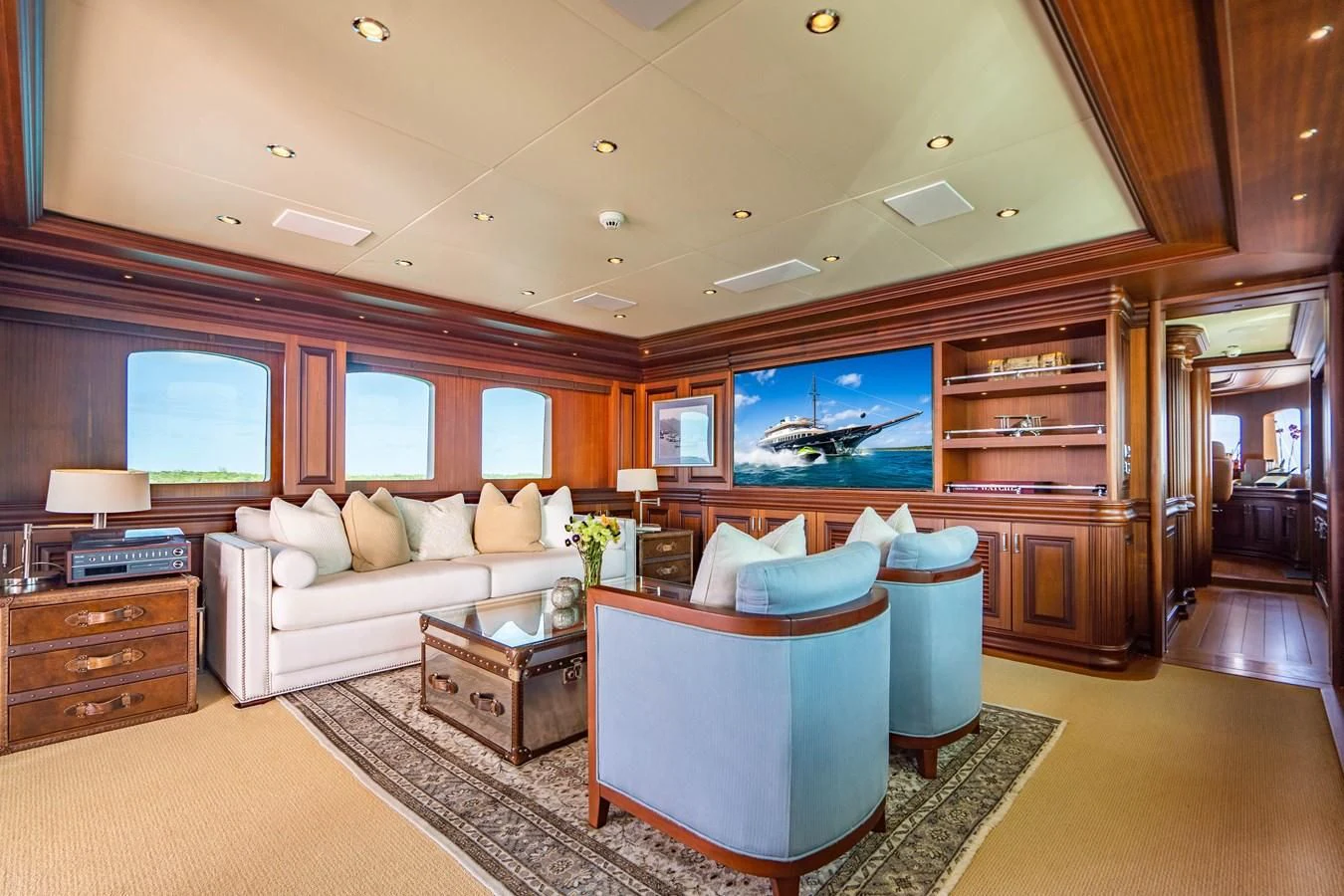 a living room with a large sofa aboard OMNIA 1 Yacht for Sale