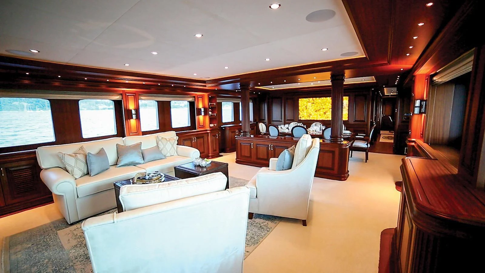 a living room with a couch and a table aboard OMNIA 1 Yacht for Sale