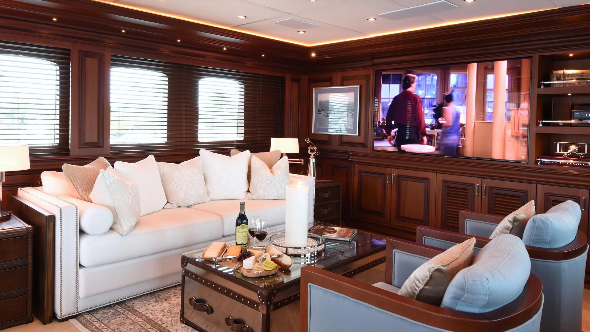 a living room with a large window aboard OMNIA 1 Yacht for Sale