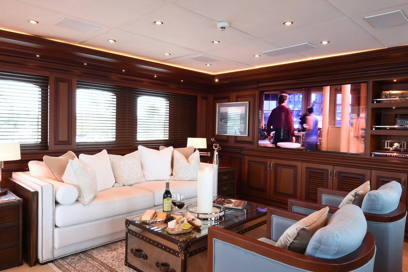 a living room with a couch and a table aboard OMNIA 1 Yacht for Sale