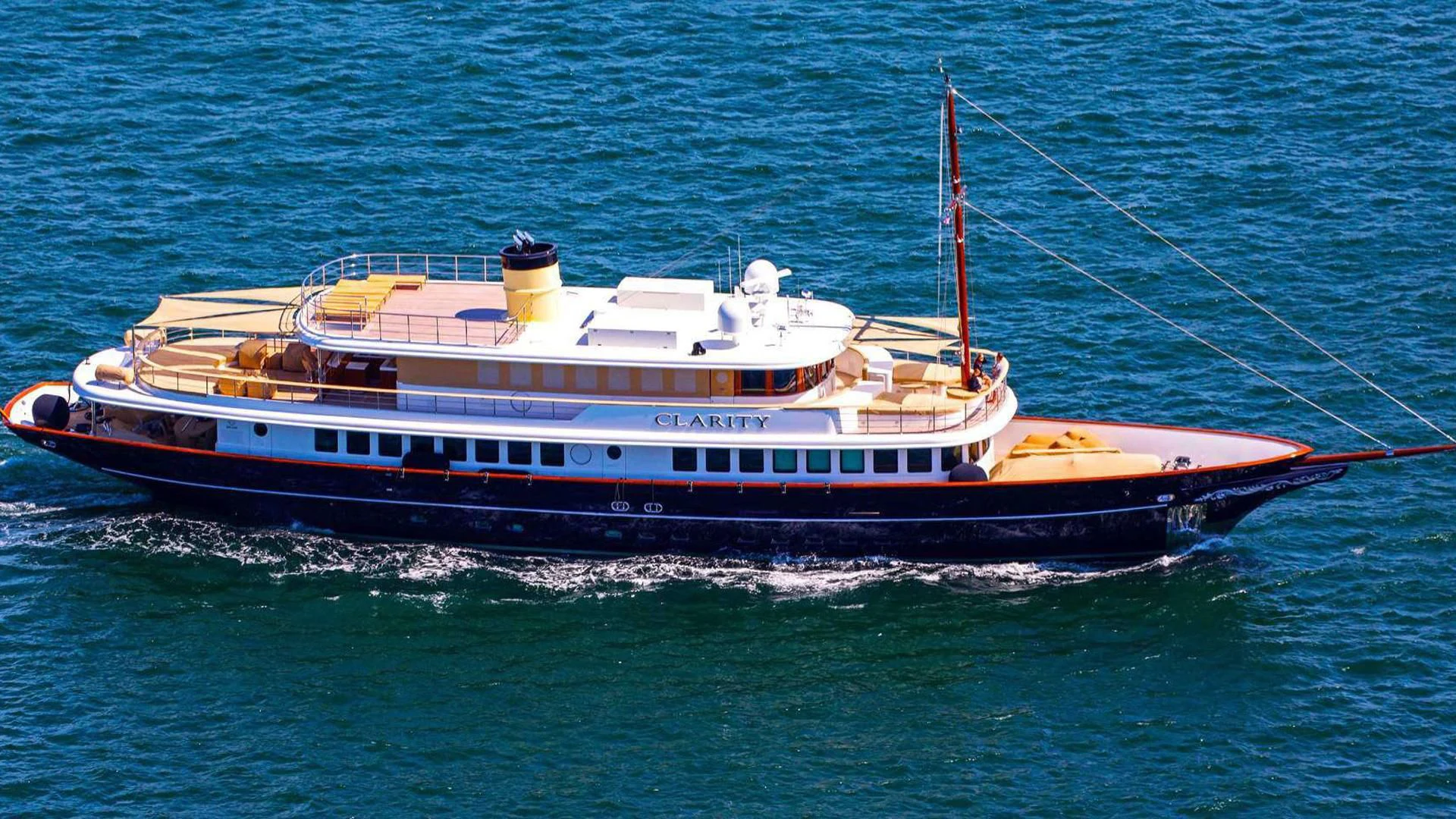 a large boat on the water aboard OMNIA 1 Yacht for Sale