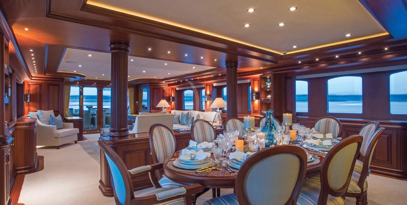 a large dining room with a large table and chairs aboard OMNIA 1 Yacht for Sale