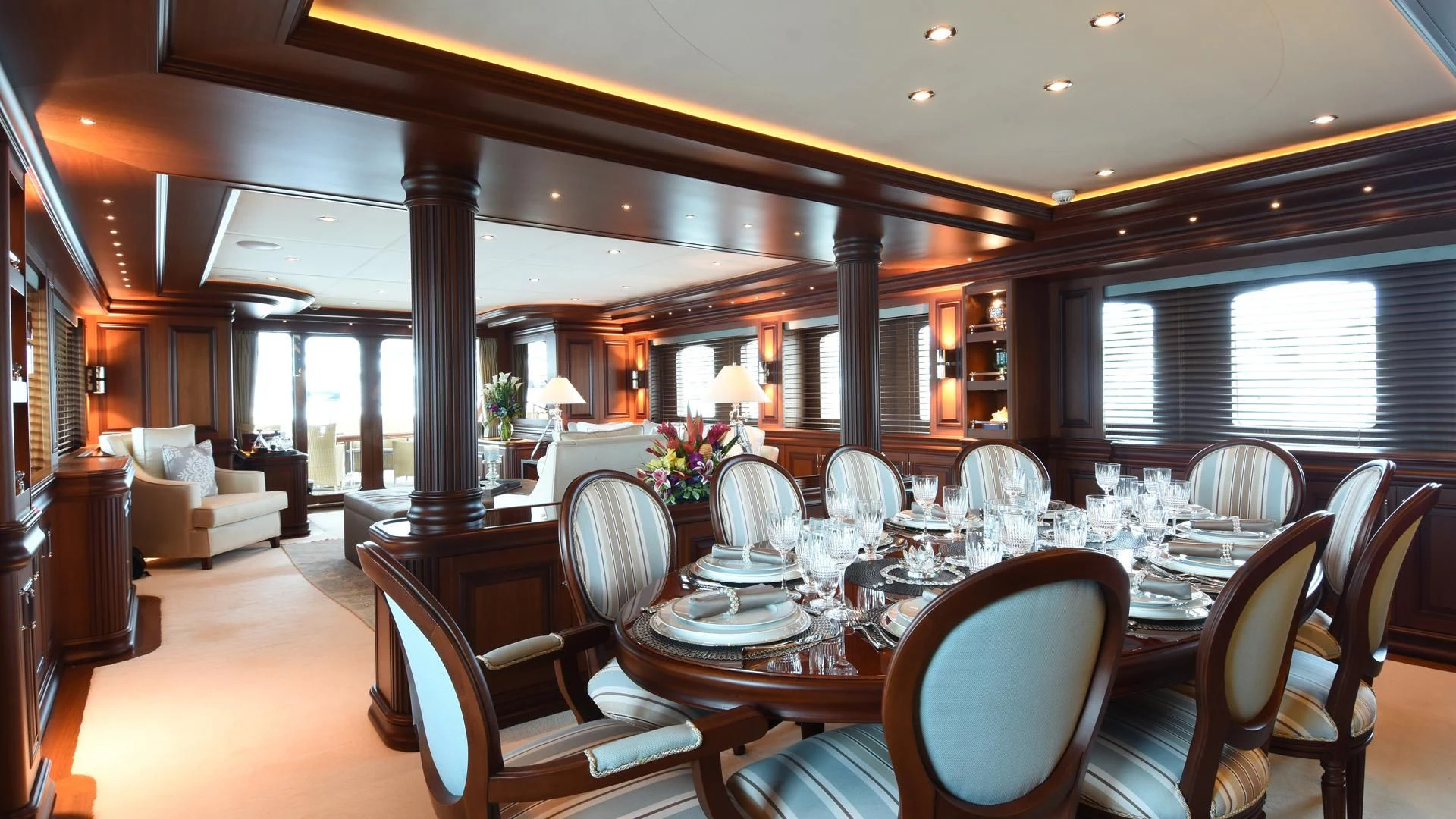 a large dining room with a large table and chairs aboard OMNIA 1 Yacht for Sale