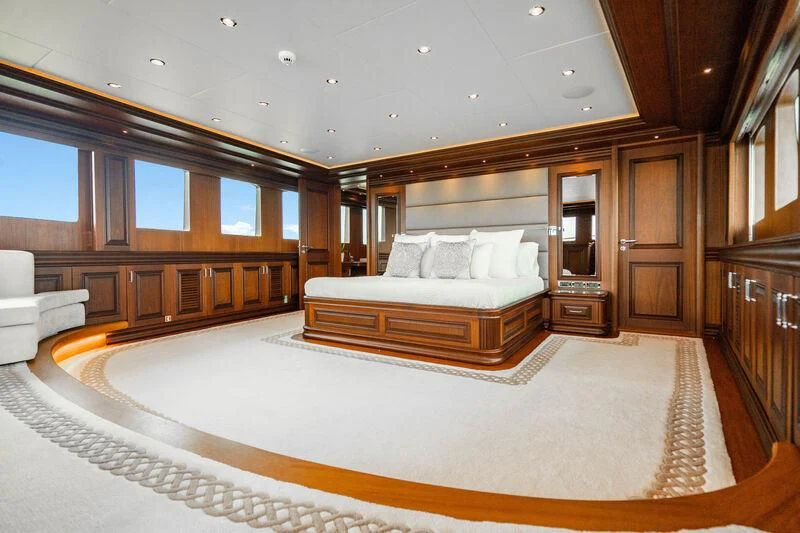 a large bedroom with a large bed aboard OMNIA 1 Yacht for Sale