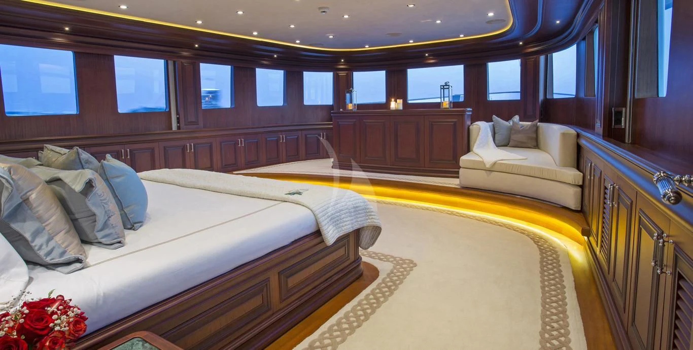 a room with a bed and a couch aboard OMNIA 1 Yacht for Sale
