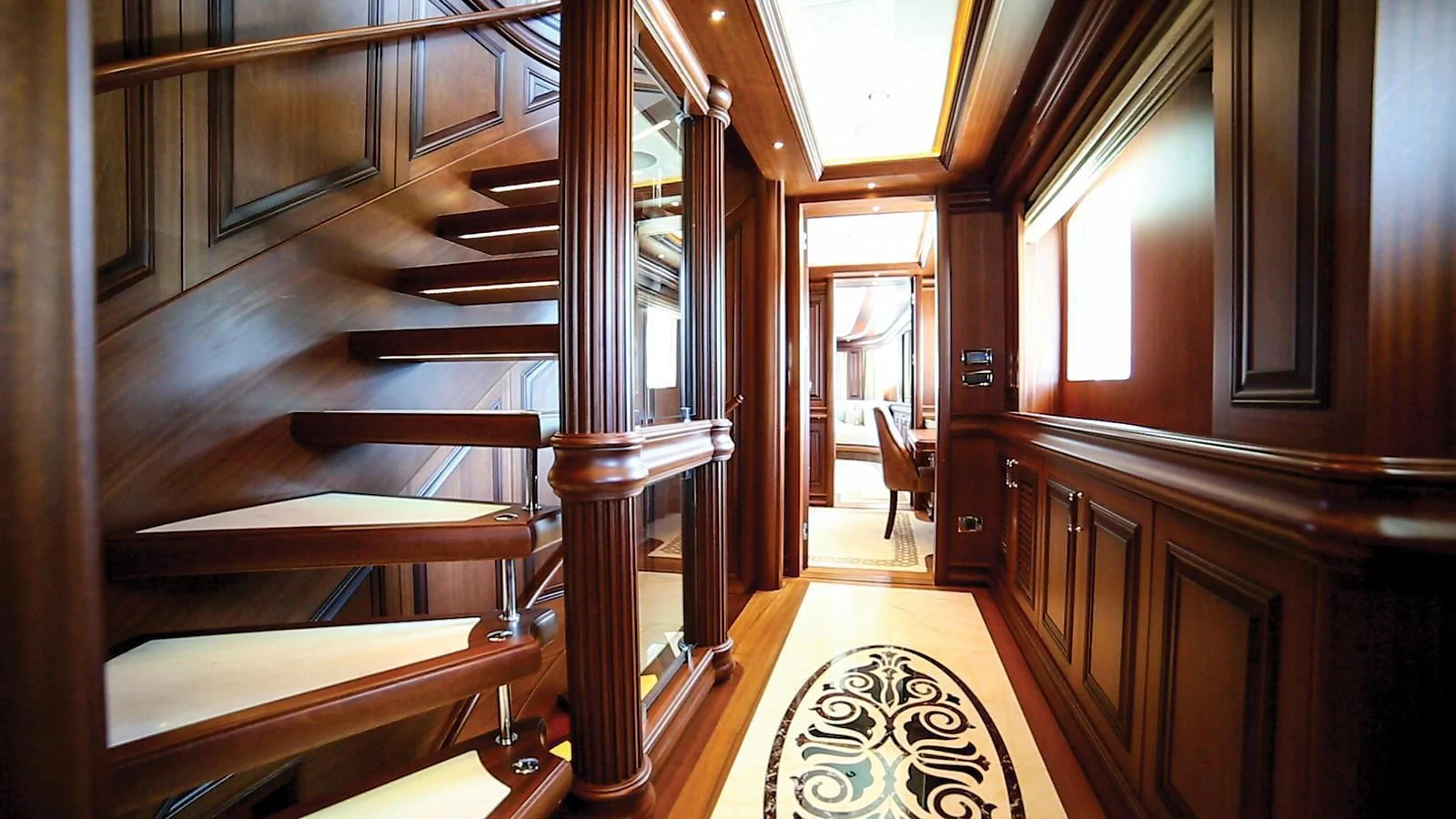 a wooden staircase in a house aboard OMNIA 1 Yacht for Sale