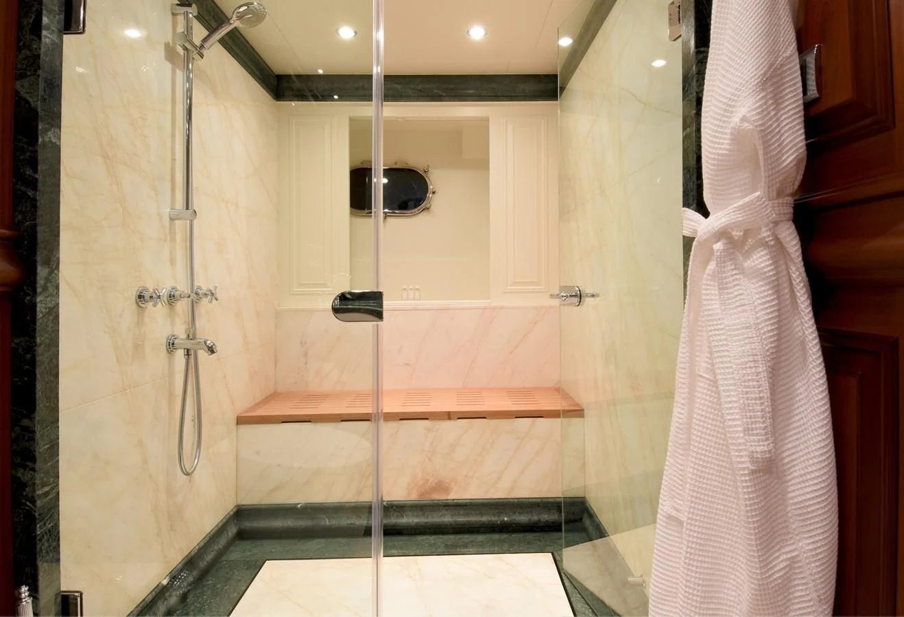 a shower unit with a towel on the wall aboard OMNIA 1 Yacht for Sale