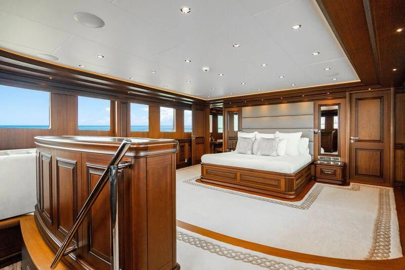 a large bedroom with a large bed aboard OMNIA 1 Yacht for Sale