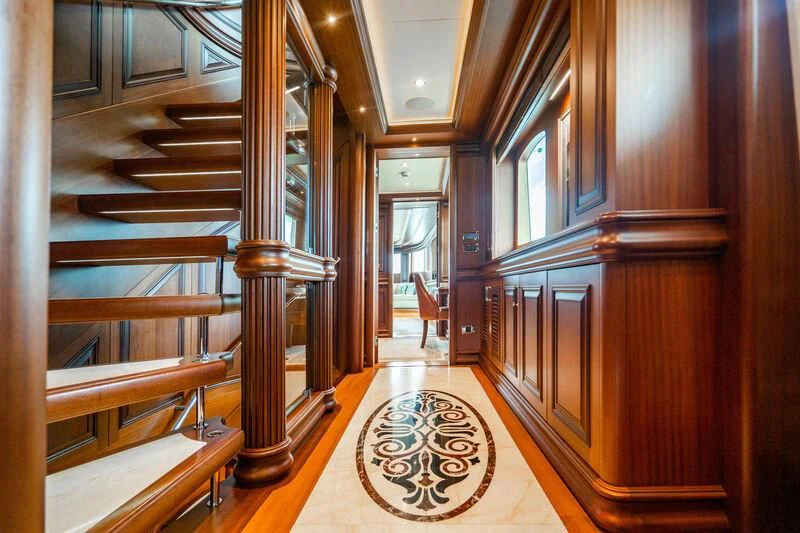 a large room with wooden floors aboard OMNIA 1 Yacht for Sale