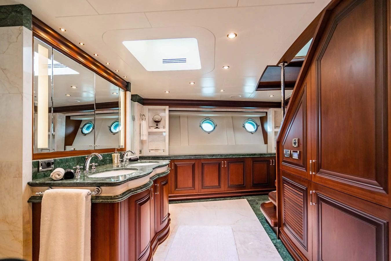 a kitchen with wooden cabinets aboard OMNIA 1 Yacht for Sale