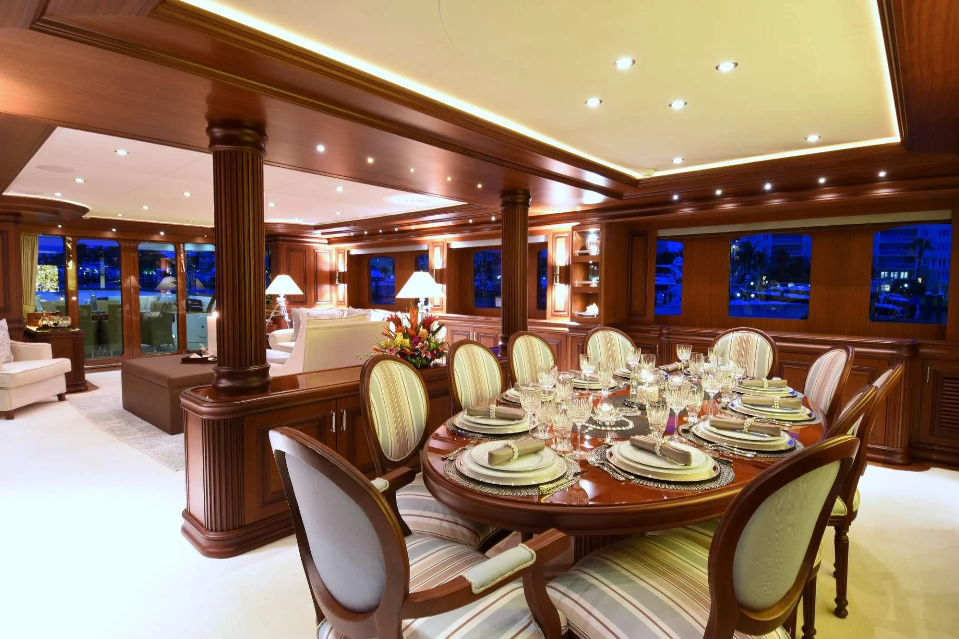 a room with tables and chairs aboard OMNIA 1 Yacht for Sale
