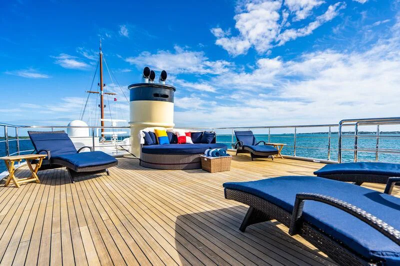 a dock with a boat and a boat on it aboard OMNIA 1 Yacht for Sale
