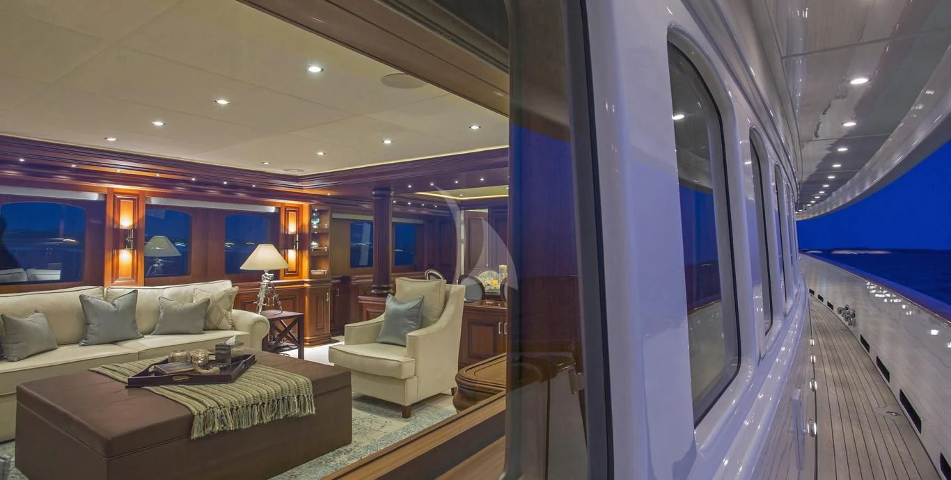 a living room with a large window aboard OMNIA 1 Yacht for Sale