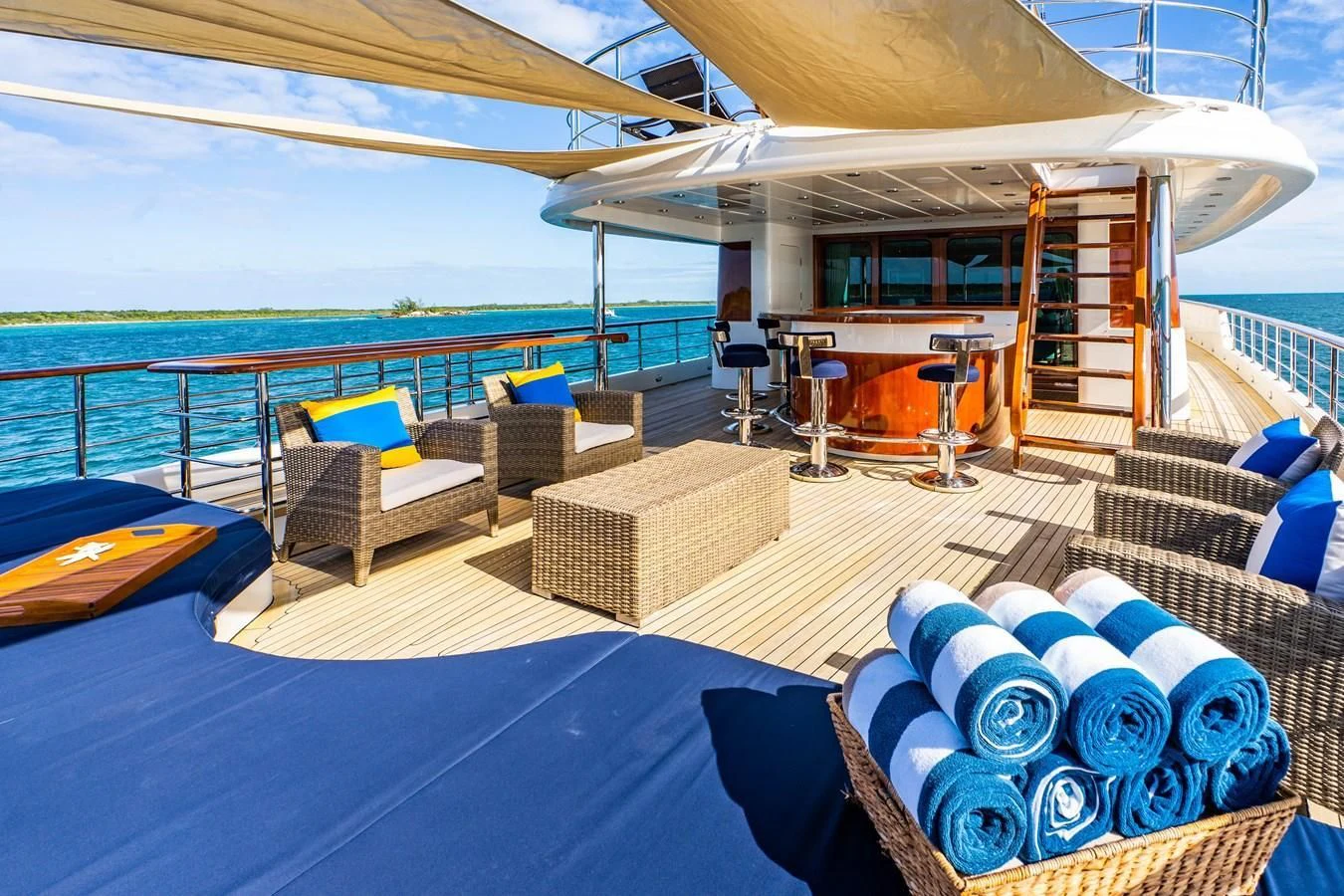 a pool with lounge chairs and a pool aboard OMNIA 1 Yacht for Sale
