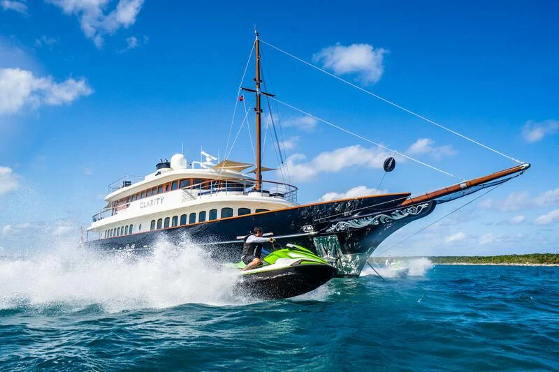 a boat with a person on it aboard OMNIA 1 Yacht for Sale