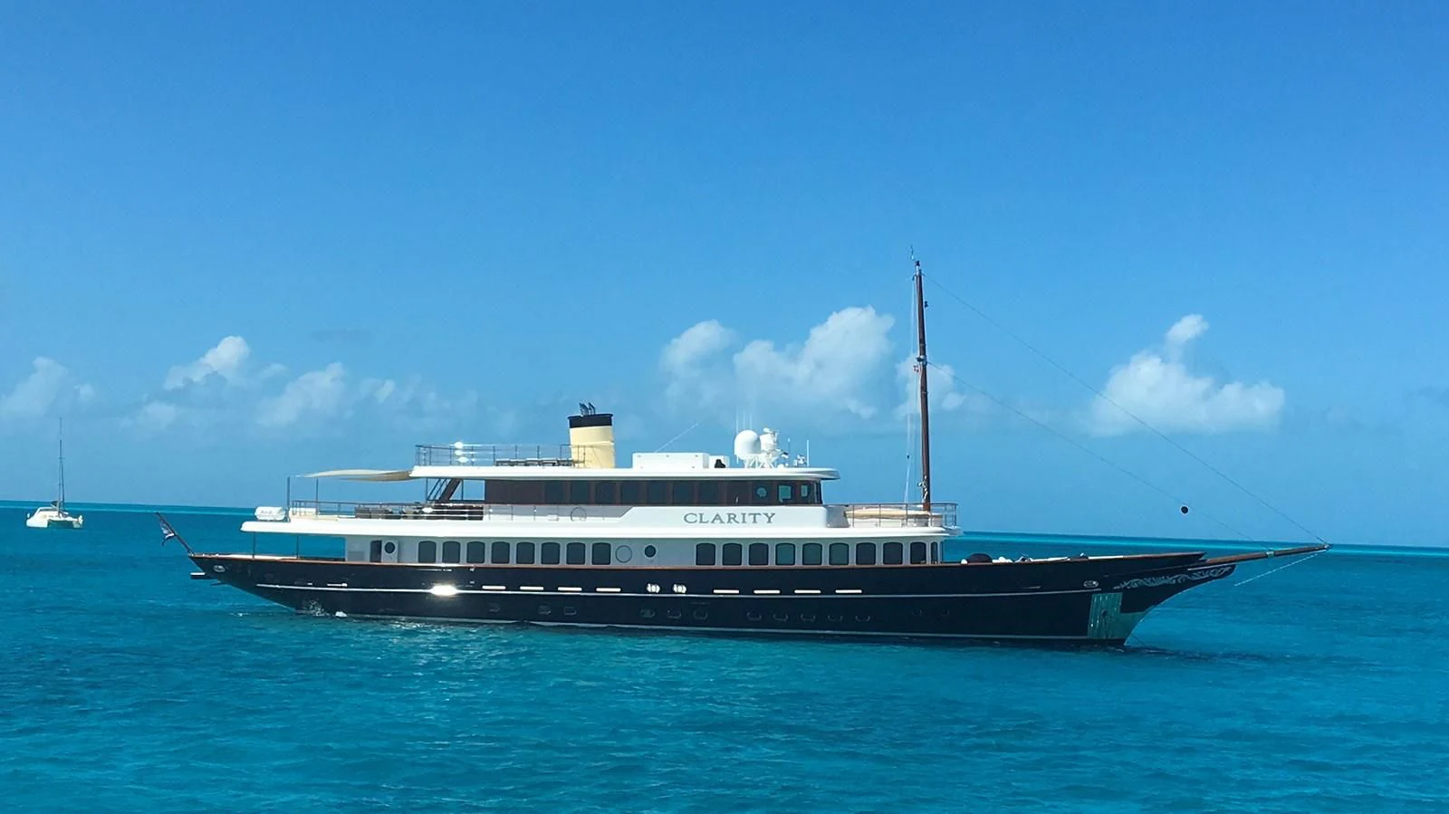 a large boat in the water aboard OMNIA 1 Yacht for Sale