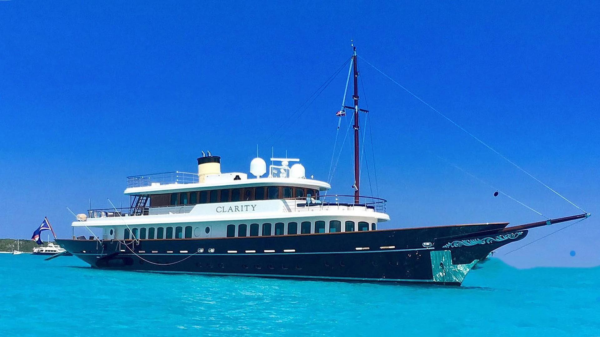 a large white boat in the water aboard OMNIA 1 Yacht for Sale