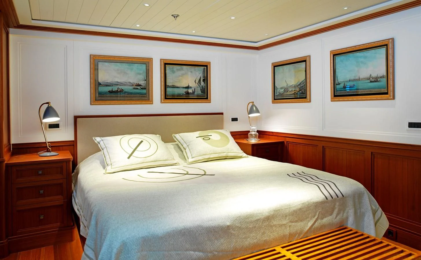 a bed with a white comforter aboard MESERRET II Yacht for Sale