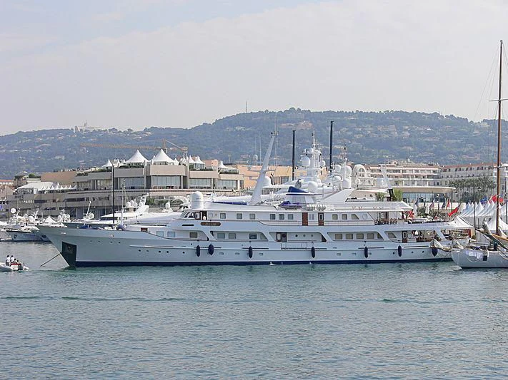 a large white boat in a harbor aboard MESERRET II Yacht for Sale