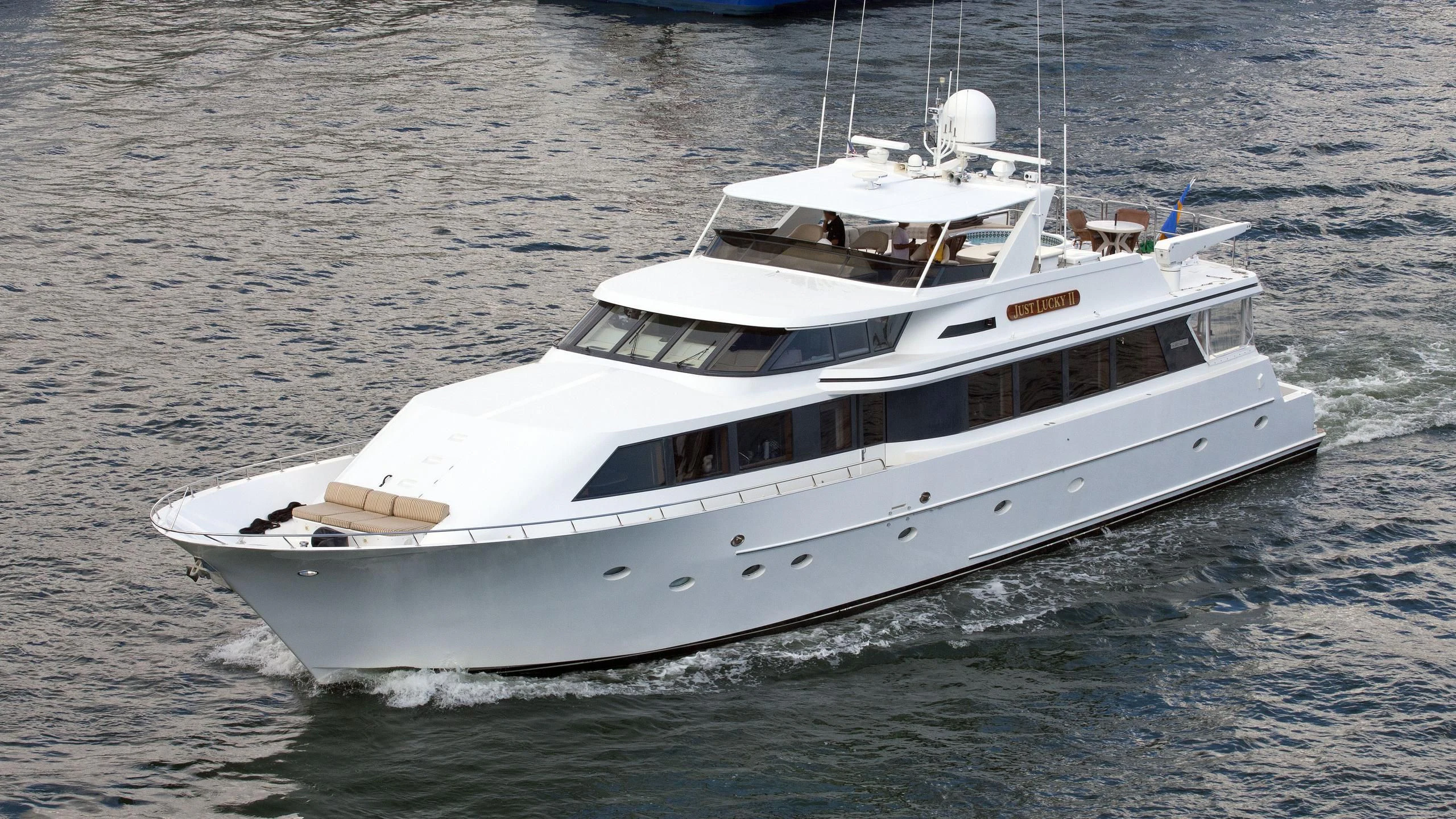 a white yacht in the water aboard THINK B.I.G Yacht for Sale