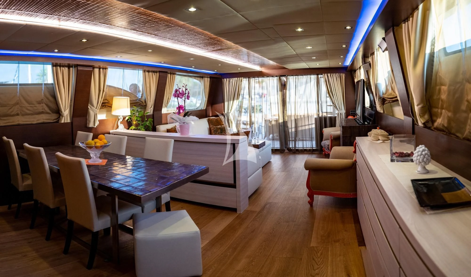 a room with a table chairs and a couch aboard ANDEA Yacht for Sale