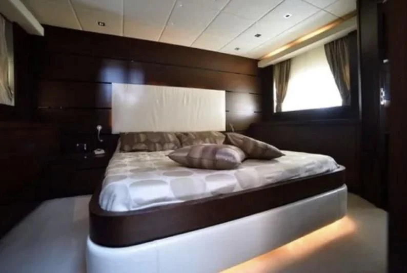 a bed with a white sheet aboard ANDEA Yacht for Sale