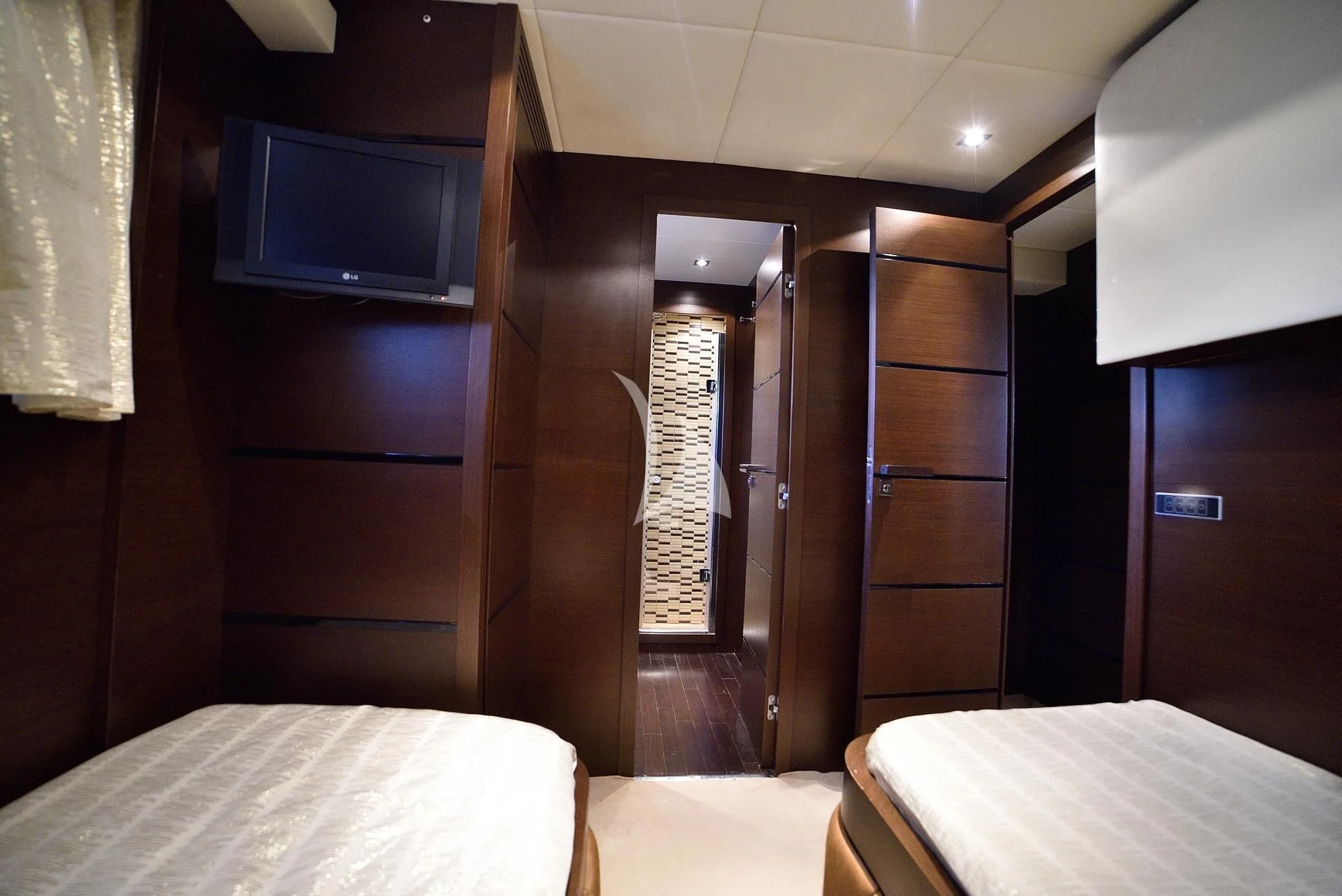 a room with a bed and a television aboard ANDEA Yacht for Sale