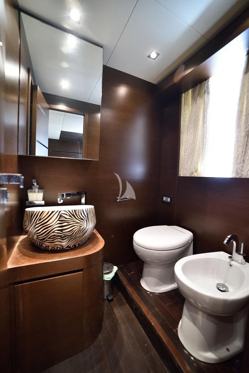 a bathroom with a toilet and sink aboard ANDEA Yacht for Sale