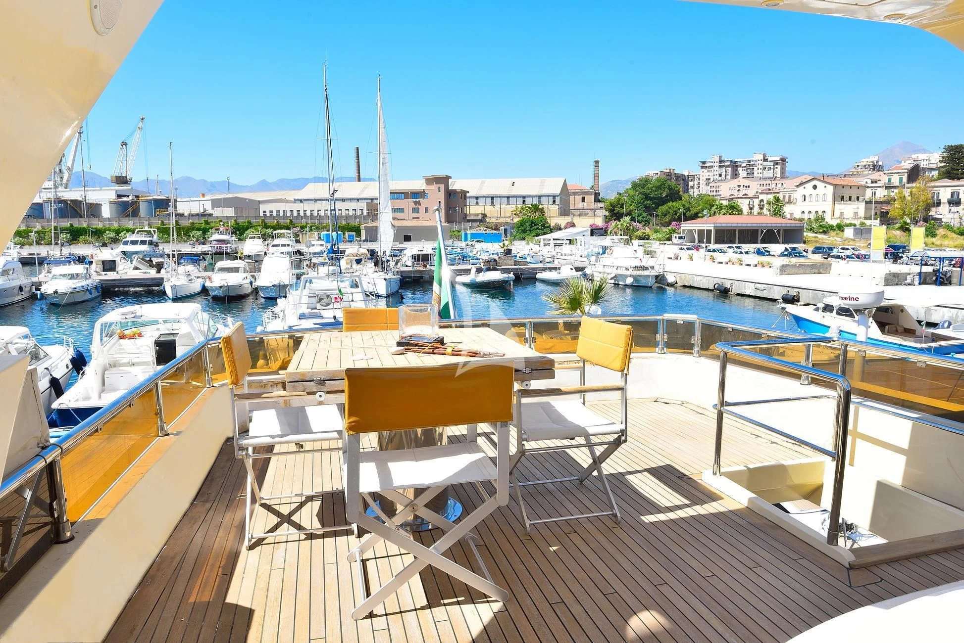 a deck with chairs and tables on it aboard ANDEA Yacht for Sale