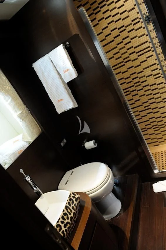 a bathroom with a toilet and a sink aboard ANDEA Yacht for Sale