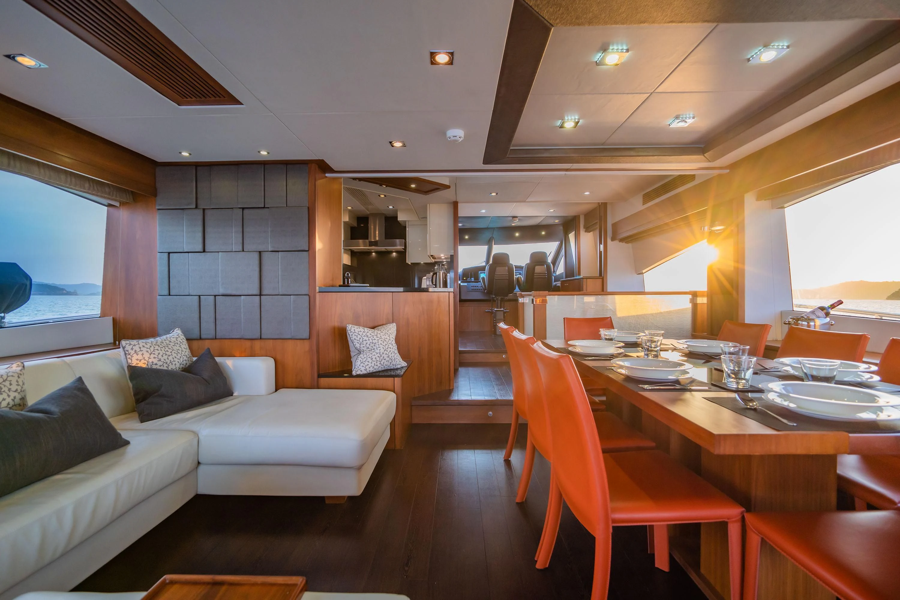 a living room with a table and couches aboard ANDEA Yacht for Sale