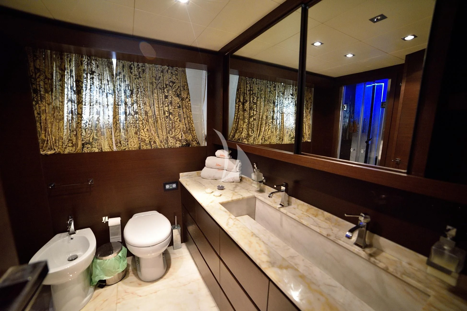 a bathroom with a large mirror aboard ANDEA Yacht for Sale