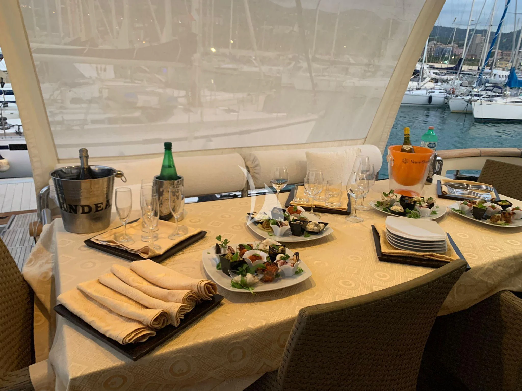 a table with food and drinks on it aboard ANDEA Yacht for Sale