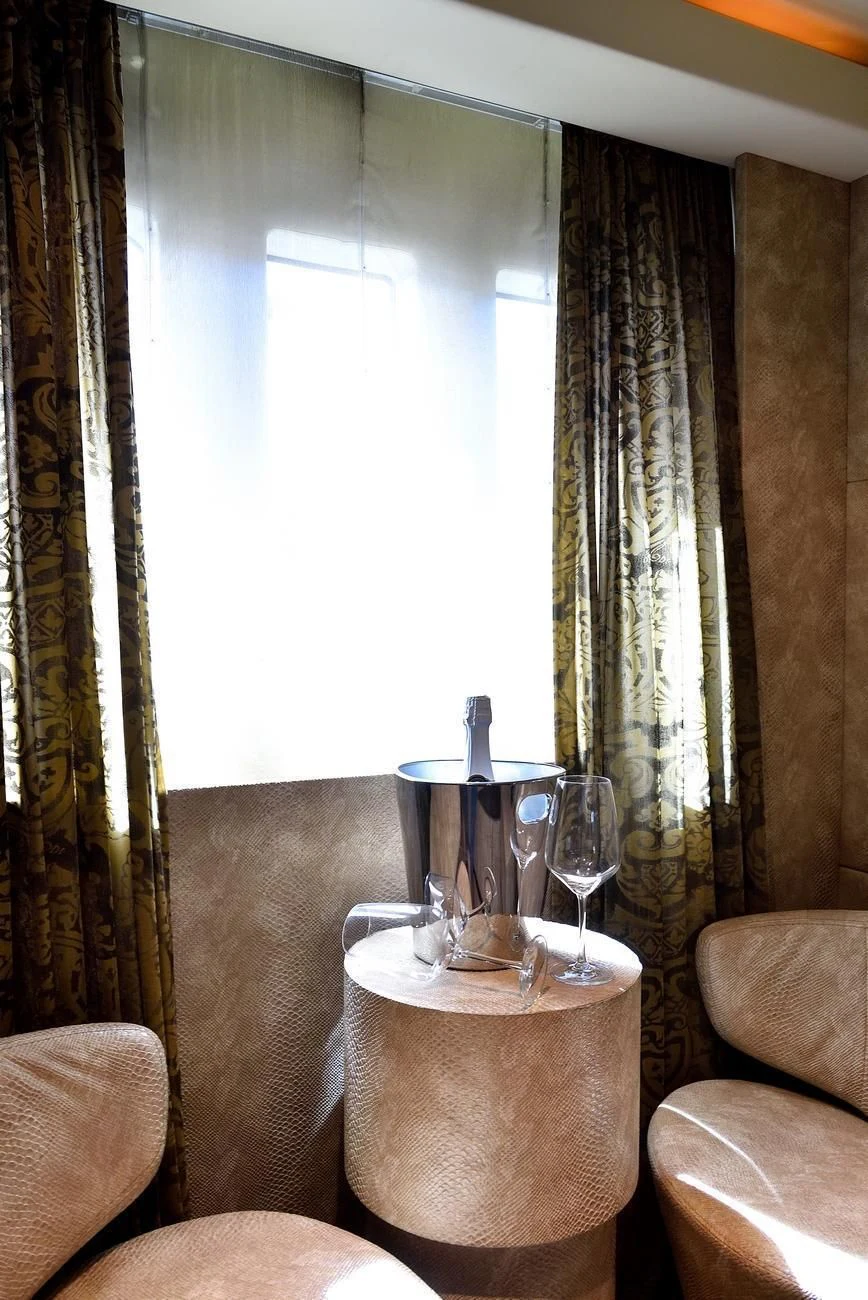 a table with glasses and a vase on it aboard ANDEA Yacht for Sale