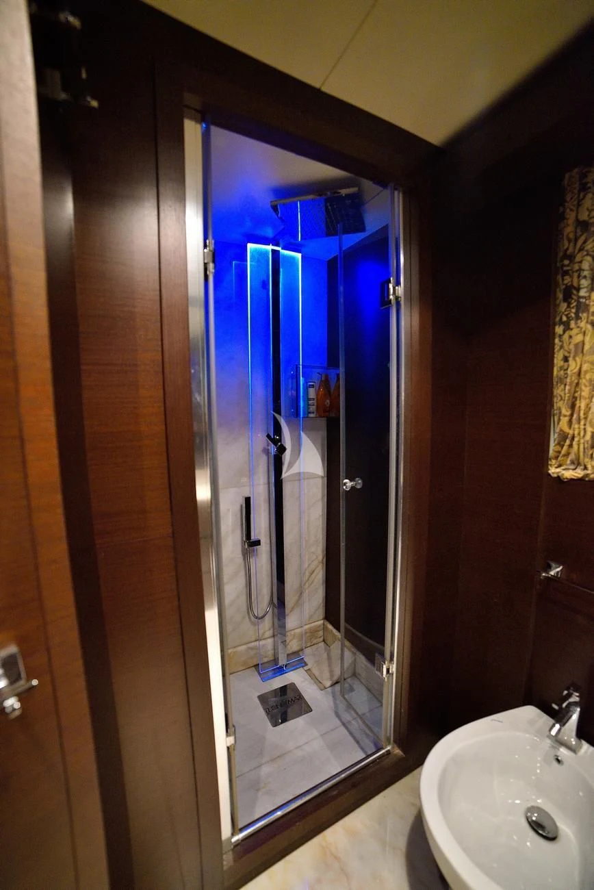 a bathroom with a glass shower aboard ANDEA Yacht for Sale