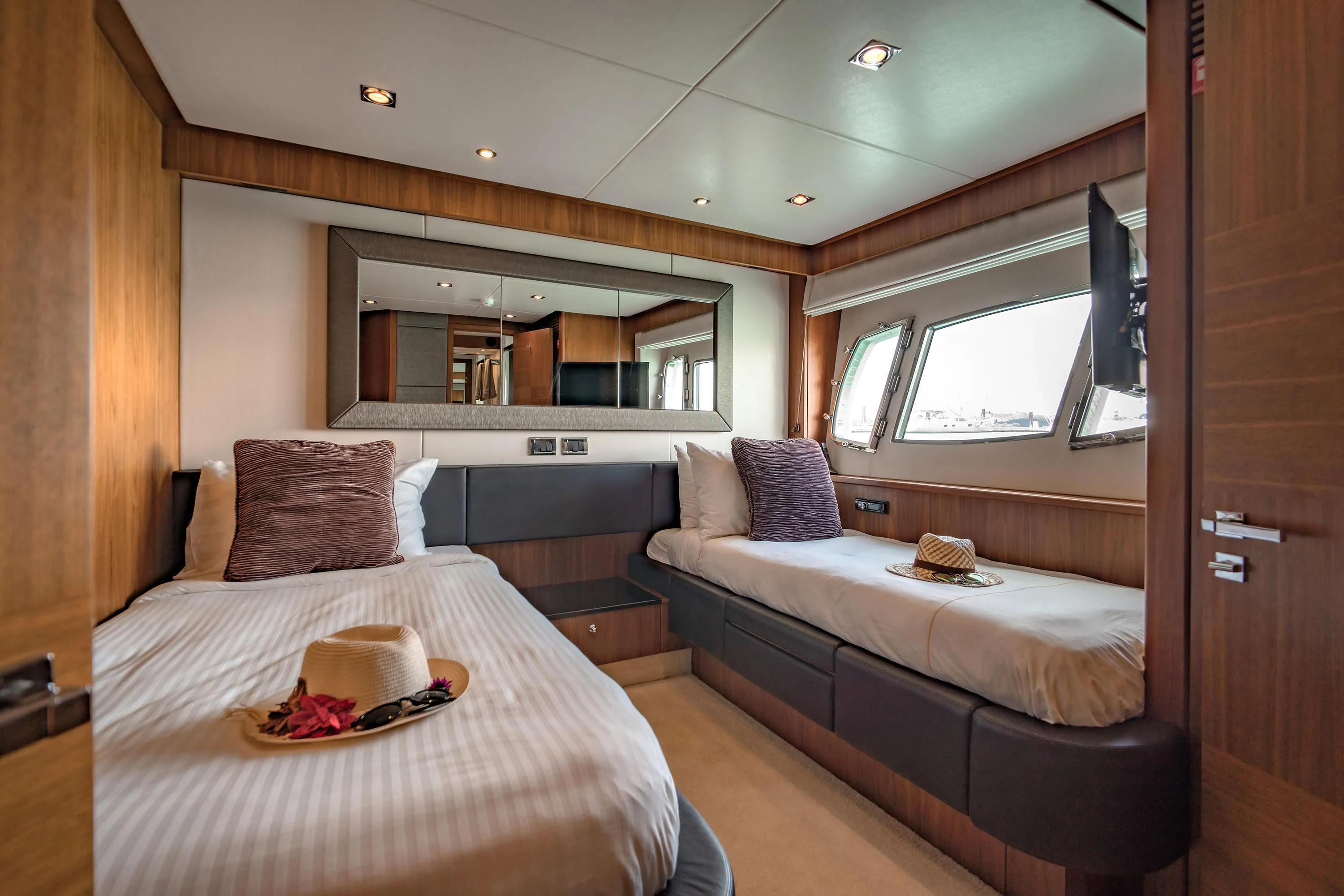 a bedroom with a bed and a television aboard ANDEA Yacht for Sale
