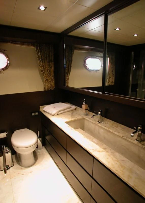 a bathroom with a large mirror aboard ANDEA Yacht for Sale