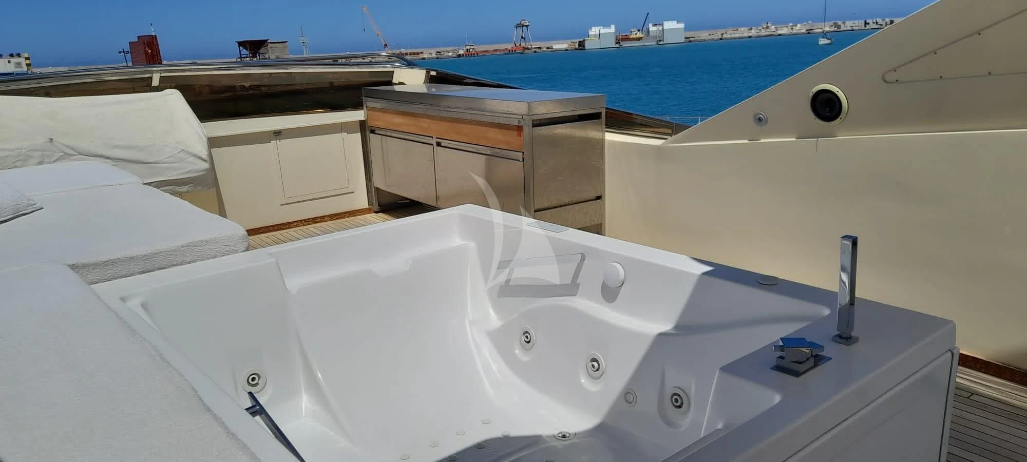 a white bathtub with a white sink and a wooden cabinet on the side aboard ANDEA Yacht for Sale