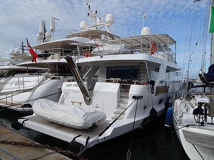 a large white boat docked aboard AQUA VIRGIN Yacht for Sale