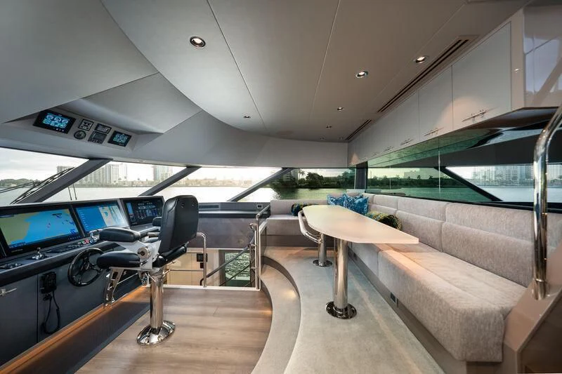 a room with a table and chairs aboard RING-N-WET Yacht for Sale