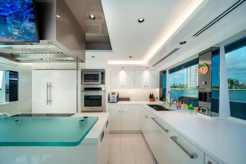 a kitchen with a pool table aboard RING-N-WET Yacht for Sale