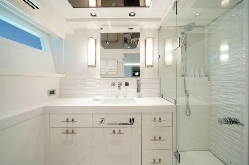 a bathroom with white cabinets aboard RING-N-WET Yacht for Sale