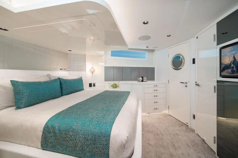 a bedroom with a bed aboard RING-N-WET Yacht for Sale