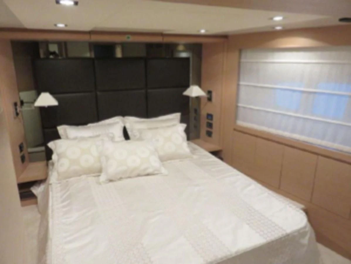 a bed with white sheets aboard THOR Yacht for Sale