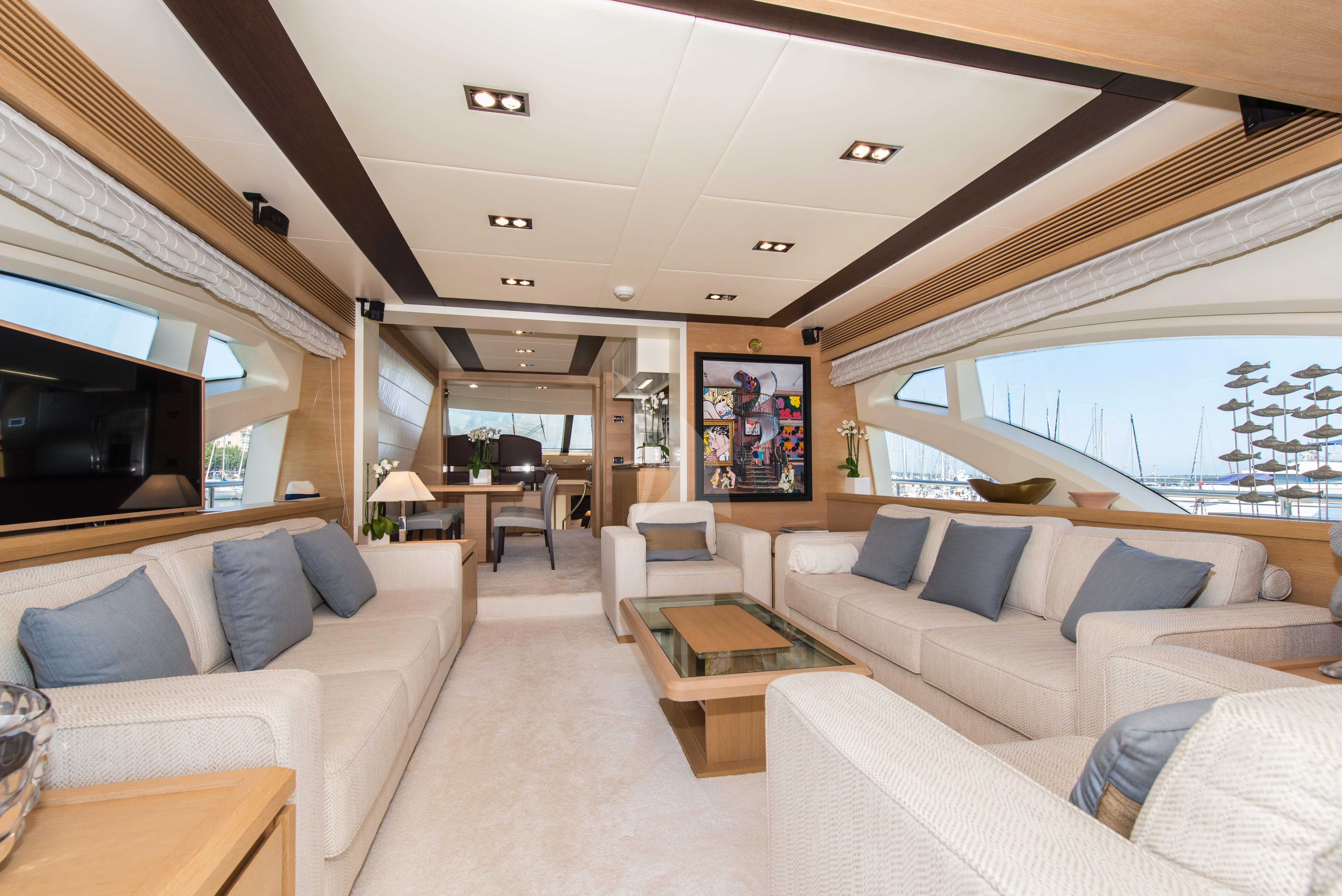 a living room with a large window aboard THOR Yacht for Sale