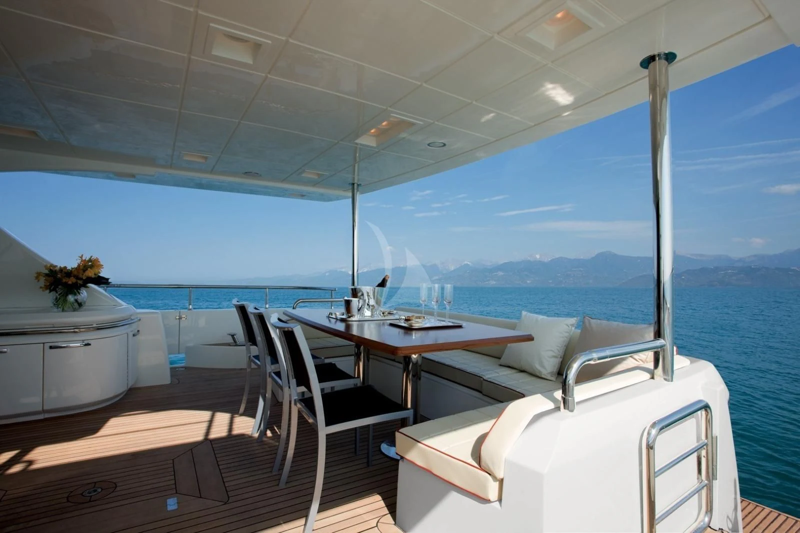 a room with a table and chairs aboard THOR Yacht for Sale