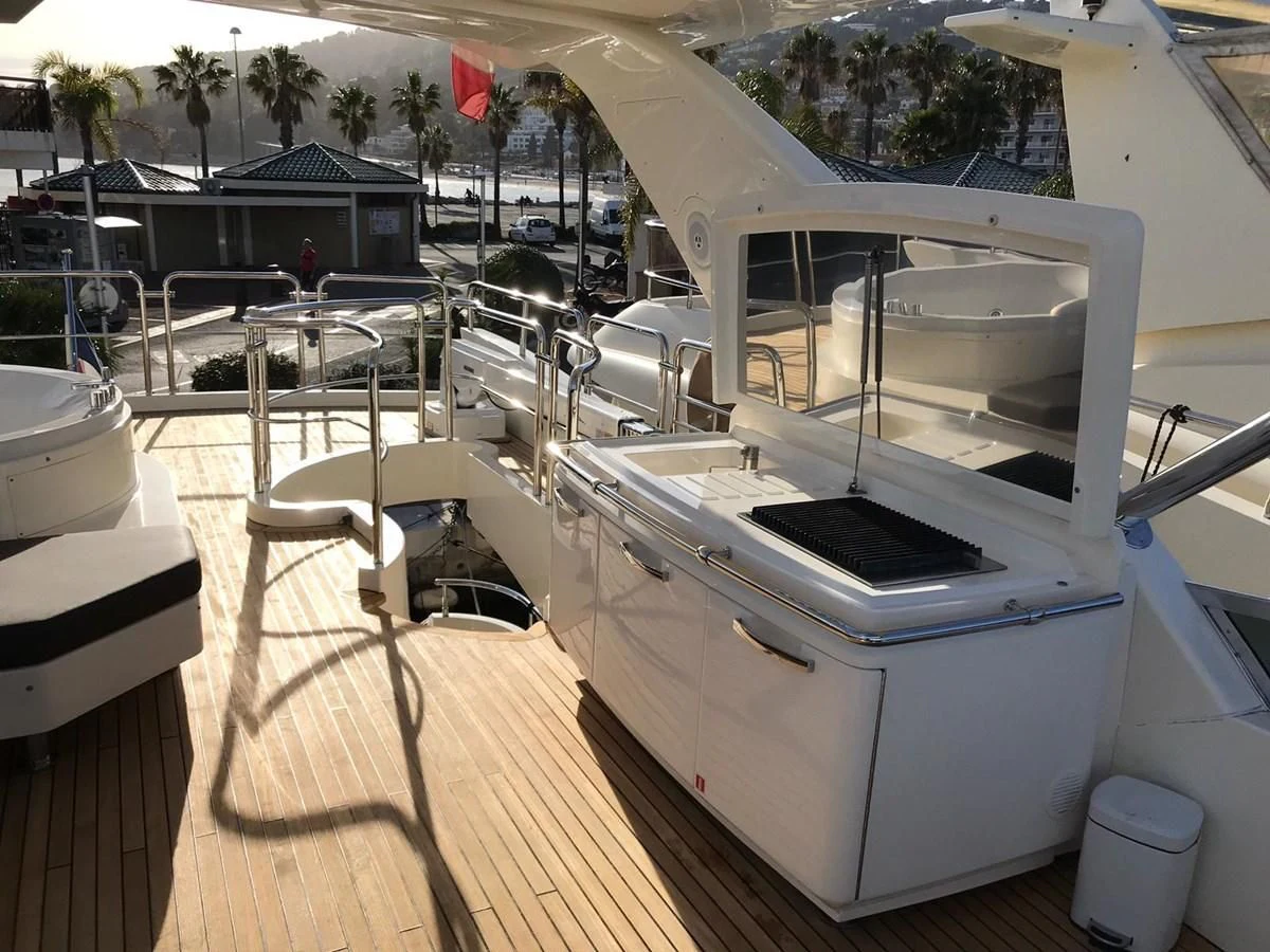 a large white machine on a wooden deck aboard THOR Yacht for Sale