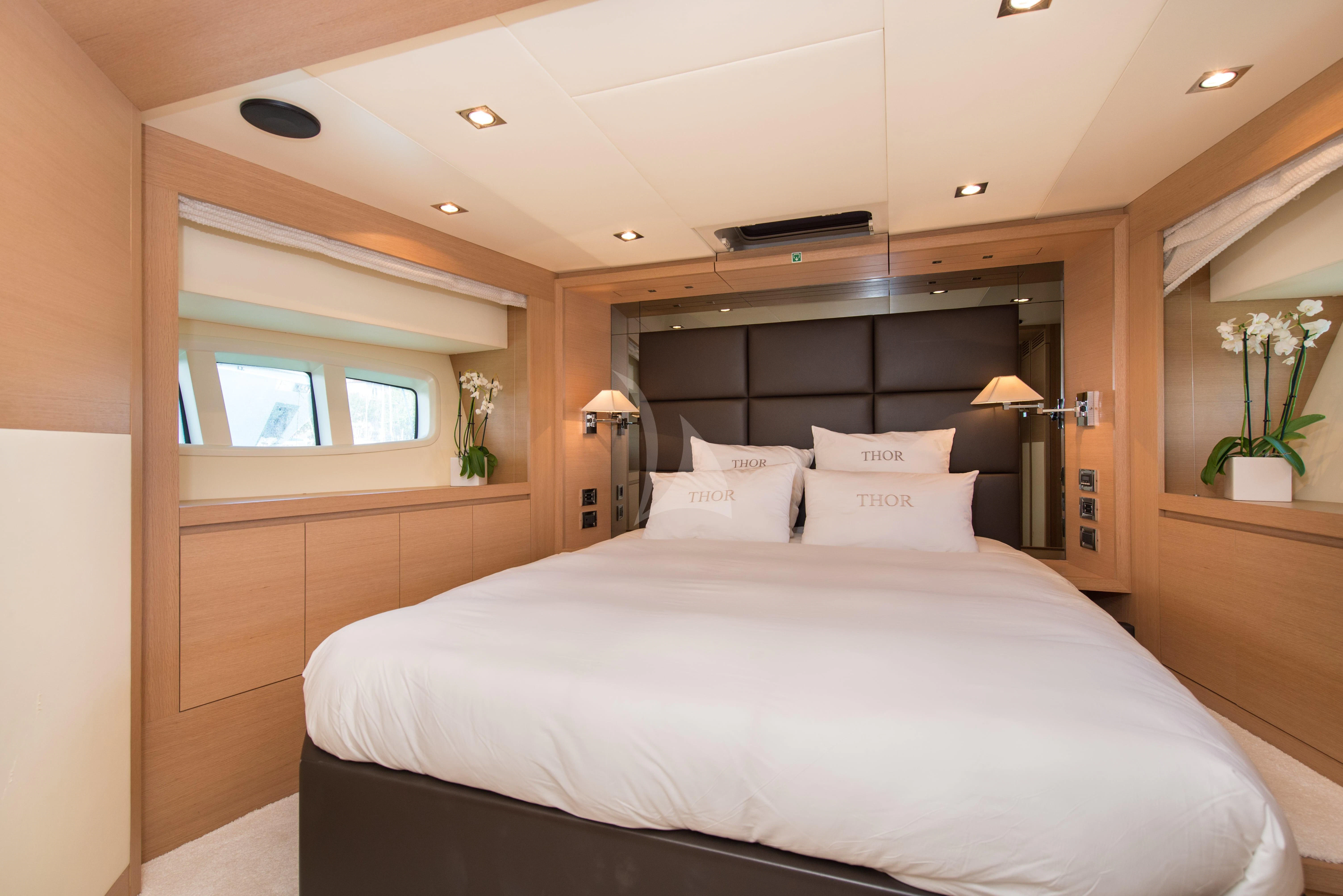 a bed in a room aboard THOR Yacht for Sale