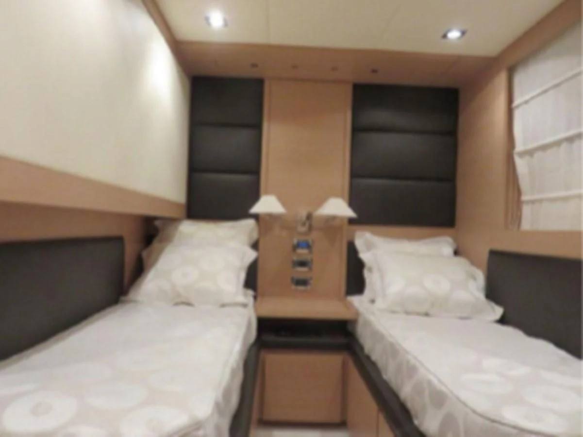 a room with two beds aboard THOR Yacht for Sale