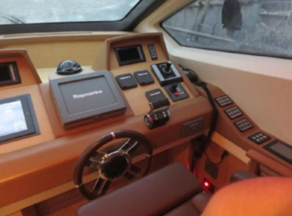 a yellow vehicle with a black steering wheel and a black wheel aboard THOR Yacht for Sale